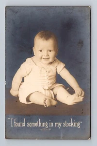 I Found Something In My Stocking Cute Smiling Baby c.1913 Real Photo Postcard - Picture 1 of 2