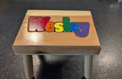 Damhorst Toys Wood Name Puzzle Step Stool Primary Colors - Wesley 9”xI2”x9” - Image 1 of 4