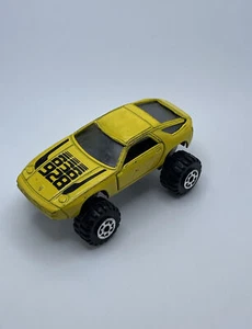 Vintage 1984 Porsche 928 Rally Road Champs Yellow 4x4 Monster Car Diecast - Picture 1 of 9