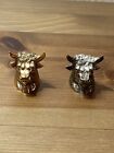 A Pair Of Bull Heads Gold And Silver Marked.