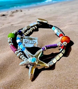 UNO DE 50 SILVER PLATED & LEATHER MULTISTRAND STARFISH RESIN BEAD BRACELET - Picture 1 of 6