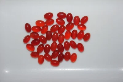 Piedras preciosas sueltas de ónix rojo natural 6x4 mm espalda plana ovaladas Foto 1 de 3