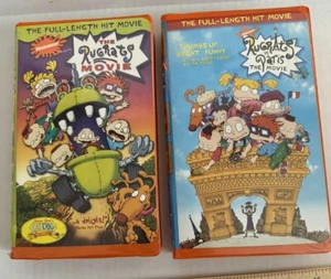 The Rugrats Movie (VHS, 1998) + Rugrats In Paris (VHS, 2000) Orange Tape Bundle - Picture 1 of 3