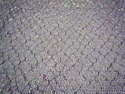 Brillo iridiscente brillante en malla de iris negro, tela por yarda 45" de ancho Foto 1 de 2