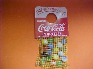 Coca Cola Murmeln im gelben Netzbeutel 60er Jahre.New old stock.Neuwertig - Bild 1 von 4