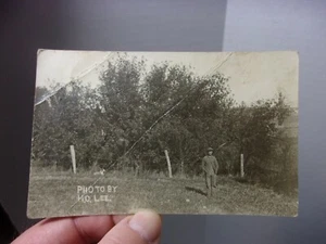 Man wearing cap standing outside with his Dog real photo Antique Postcard - Picture 1 of 2