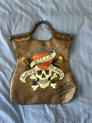 Ed Hardy Love Kills Slowly Tote Bag Skull Design Bronze And Blood Red Interior - Image 1 of 4