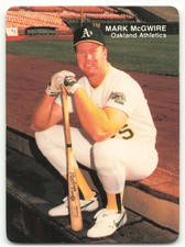 1990 MOTHER'S COOKIES MARK MCGWIRE MARK MCGWIRE (SITTING ON DUGOUT STEP) OAKLAND