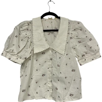Blusa Levis Royce para mujer talla mediana blanca con cuello floral manga corta abullonada Foto 1 de 4
