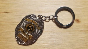 Resident Evil Schlüsselanhänger - S.T.A.R.S. Raccoon (City) Police Department #1 - Picture 1 of 2