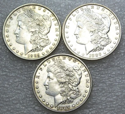Dólar de plata Morgan 1885, 1886, 1887 AU/BU Frosty lote de 3 monedas #N234 Foto 1 de 2
