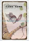 dads garage signs Pennsylvania Game News 1976 flying squirrel metal tin sign