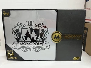 Hasbro Gaming Monopoly 64 Pezzi Signature Token Edition Gioco da Tavolo G4 - Foto 1 di 2