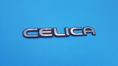 94 95 96 97 98 99 TOYOTA CELICA TAPA MALETERO TRASERO EMBLEMA INSIGNIA SÍMBOLO LOGOTIPO OEM A2 Foto 1 de 3
