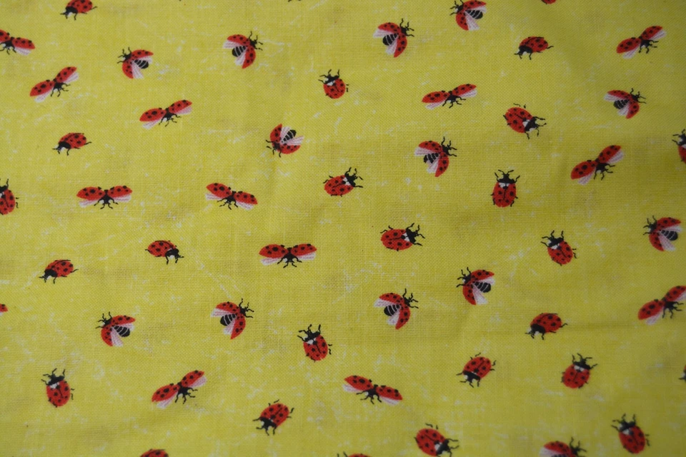 7/8ths of a yard ladybugs on yellow plus a hefty tail cotton fabric - Image 1 of 2
