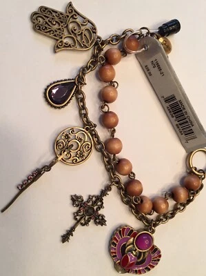 NUEVO CON ETIQUETAS Pulsera con Dije Guess Tono Dorado Metal-Púrpura Estrás 'Es un Mundo Pequeño' Foto 1 de 4