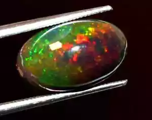 Opale etiope nero naturale 3,20 ct 100% ovale Welo fuoco cabochon pietra preziosa sfusa - Foto 1 di 3