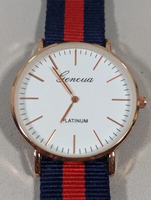 Reloj Geneva Platino Esfera Blanca Redonda Tono Dorado Caja Rojo Azul Lona Banda Foto 1 de 4
