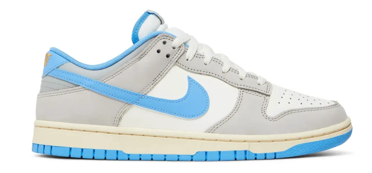 Preços baixos em Nike Dunk Low Athletic Department - University