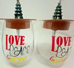 2 19oz. Stemless Wine Glasses W/Bottle Christmas Tree Toppers and LOVE/PEACE/JOY - Picture 1 of 2