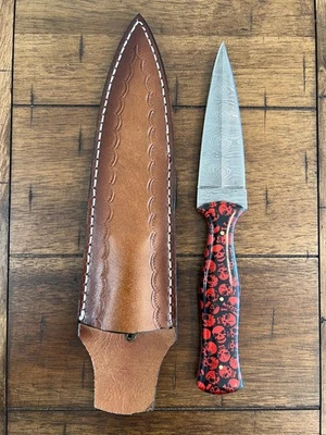 CUSTOM HANDMADE DAMASCUS RESIN SKULL HANDLE BOOT DAGGER WITH LEATHER SHEATH - Image 1 of 4