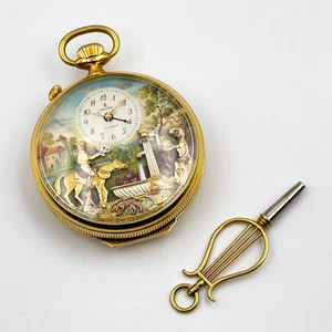 Reuge SA: vergoldete Taschenuhr mit Musikspielwerk, Figurenautomat & Wecker - Bild 1 von 5