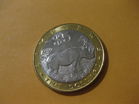 2002 Zimbabwe Coin  5 Dollars  RHINOCEROS  super nice high grade coin Cover