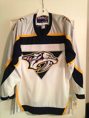 CAMISETA OFICIAL DE HOCKEY CCM NHL NASHVILLE HOMBRE GRANDE Foto 1 de 4