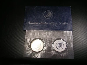 Dólar Morgan de plata 1884-O paquete suave GSA de $1 con sobre - Imagen 1 de 3