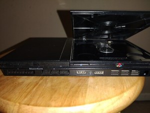 Sony PlayStation 2 Slim with controller and 5 Games with 1 Movie