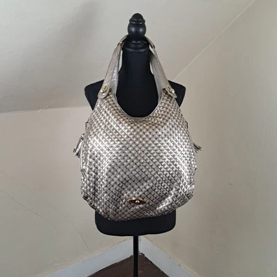 Bolso Hobo Elliott Lucca Metálico Dorado y Plateado Cartera de Cuero Trenzado Foto 1 de 4