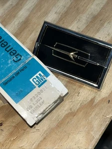 1977 NOS Oldsmobile Cutlass Header Emblem GM Part Number GM # 556871 - Picture 1 of 15