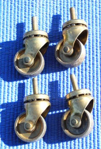 Vintage ball bearing swivel casters 1  1/4" solid brass wheel and metal frame - Picture 1 of 8