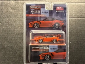 1/64 TARMAC WORKS MIJO EXCLUSIVES VEILSIDE NISSAN FFZ400 FAIRLADY ORANGE - Picture 1 of 2