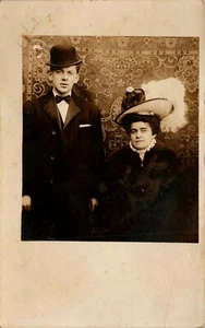 1908 Woman in Fancy Hat & Well Dressed Man In Derby Hat RPPC Lovely Couple - Picture 1 of 2