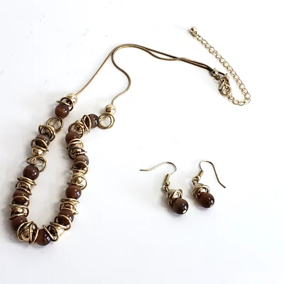 Pendientes collar vintage de cuentas y anillos ámbar deslizantes tono dorado sin marca años 70 Foto 1 de 4