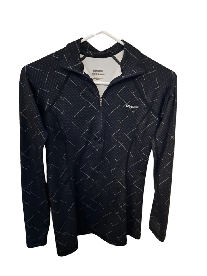 Camisa de correr Reebok para mujer talla XS contraste geométrico 1/4 cremallera Foto 1 de 1