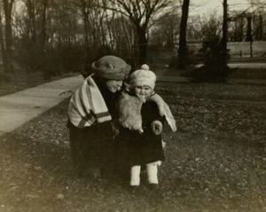 Woman Kneeling Down By Baby With Hat & Jacket B&W Photograph 2.75 x 4.5 - Picture 1 of 3