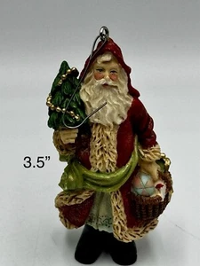 Santa Claus Shaped Resin Christmas Ornament Holding A Tree And Presents 3.5” - Picture 1 of 7