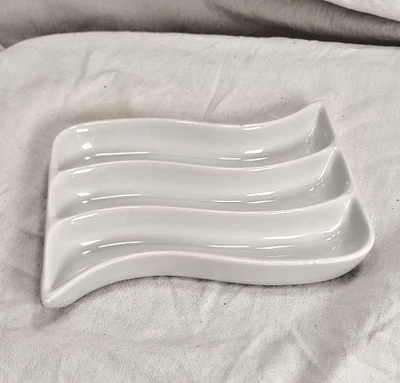 Crate and Barrel olive tray, white porcelain, wavy, three slots, 7" by 5" by 1" - Image 1 of 3