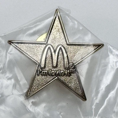McDonalds NEW 2013 “i’m lovin it” Golden Arches Gold Star Lapel Hat Pin 1” - Image 1 of 4