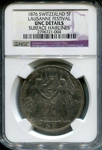1876 Switzerland 5 Franc "Lausanne Festival" - NGC UNC Details  - Picture 1 of 2
