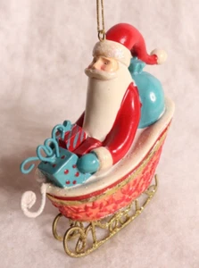 Whimsical Santa in Sleigh Christmas Porcelain Ornament - Picture 1 of 5