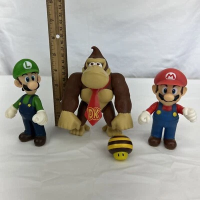 Lot of 4 Super Mario Vinyl Characters - Mario, Luigi, Donkey Kong, Bee - 2009 - Image 1 of 4
