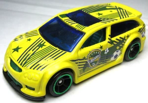 2013 HOT WHEELS AUDACIOUS YELLOW 1:64 DIECAST 2 3/4" CAR W/ SOCCER BALLS - NICE - Picture 1 of 6