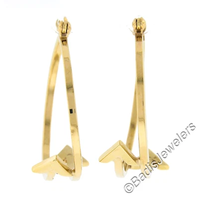Pendientes de aro pulidos de doble flecha grandes de oro amarillo de 14 quilates de 29 mm con dirección opuesta Foto 1 de 4