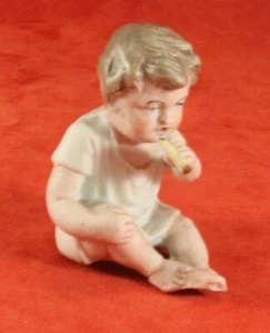 Antique Bisque Small Piano Baby Figurine - Boy Eating Cake - Germany - Picture 1 of 4