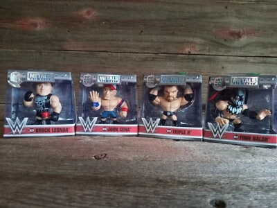 Cuatro figuras pesadas de lucha a presión nuevas en paquete Foto 1 de 4