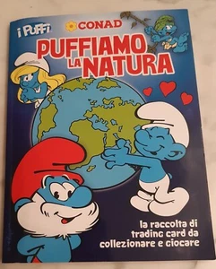 ALBUM FIGURINE " PUFFIAMO LA NATURA " - I Puffi - Conad - card - Album completo - Foto 1 di 3