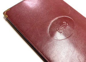 CARTERA LARGA CARTIER VINTAGE MUST CC EMBLEMA CUERO DOBLE PLIEGUE FRANCIA BORGOÑA ROJA - Imagen 1 de 19